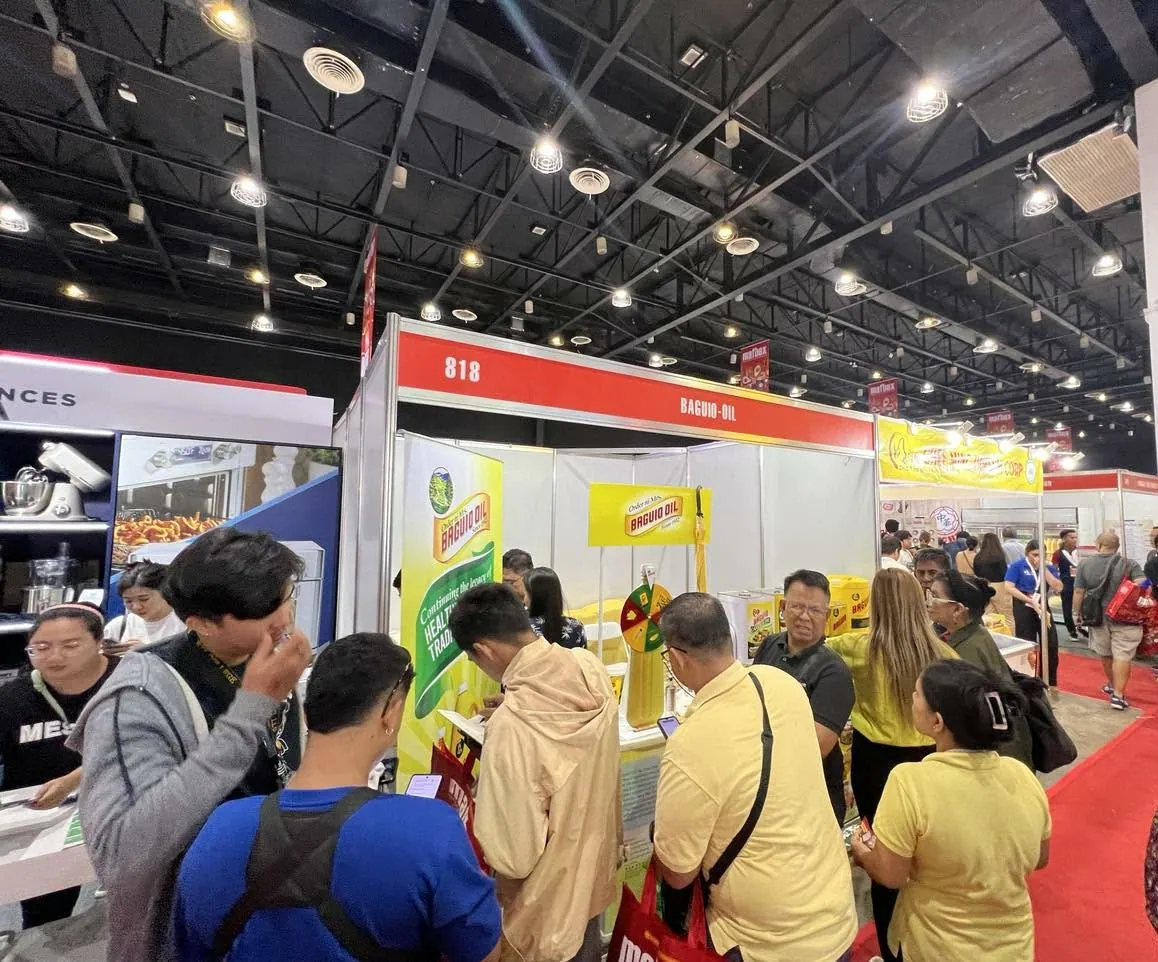 Visitors at the Baguio Oil booth during MAFBEX 2024