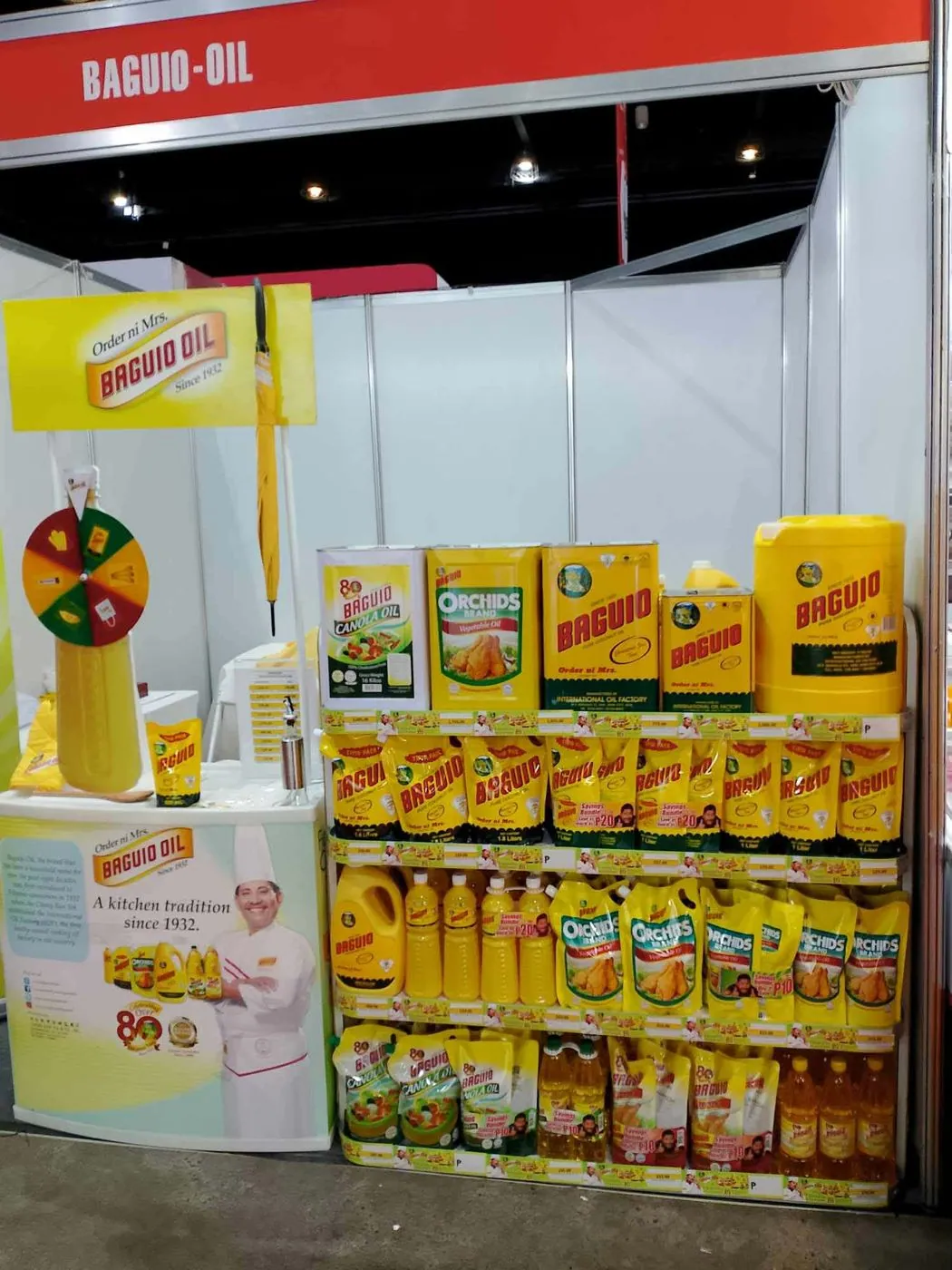Baguio Oil spin-the-wheel and product wall at MAFBEX 2024